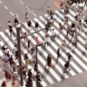 Group of pedestrians crossing a large crosswalk