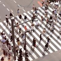 Group of pedestrians crossing a large crosswalk