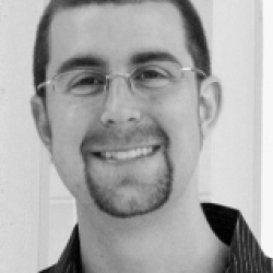 A man in front of a wall